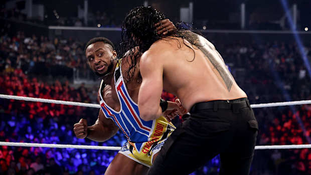 Big E delivers a punch to Roman Reigns